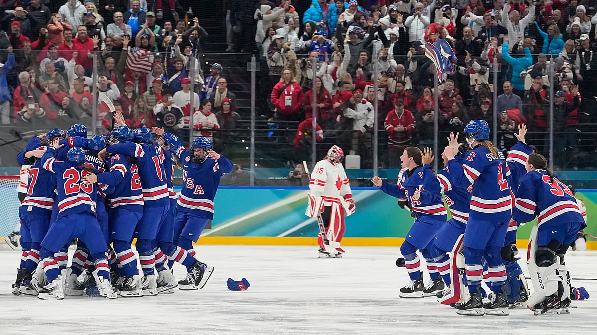 AP Photo/Hassan Ammar : United States players celebrate after a women's ice hockey gold medal game between the United States and Canada at the 2026 Winter Olympics, in Milan, Italy, Thursday, Feb. 19, 2026.
