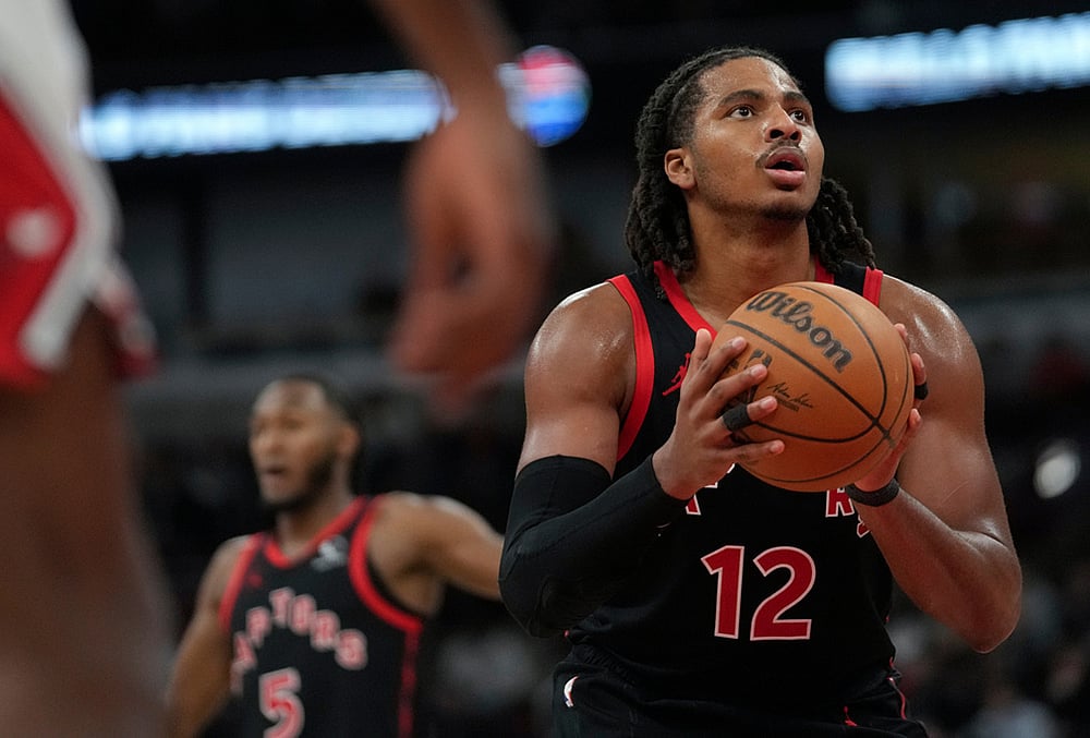 | Photo: AP/Erin Hooley : Toronto Raptors forward Collin Murray-Boyles (12) prepares to take a free throw during the second half of an NBA basketball game against the Chicago Bulls in Chicago. 