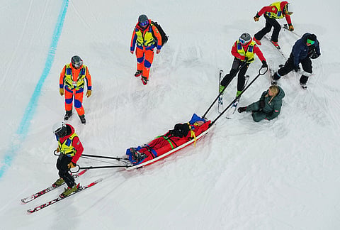 Medics stretcher off Canada's Cassie Sharpe after she crashed during the women's freestyle skiing halfpipe qualifications at the 2026 Winter Olympics, in Livigno, Italy.