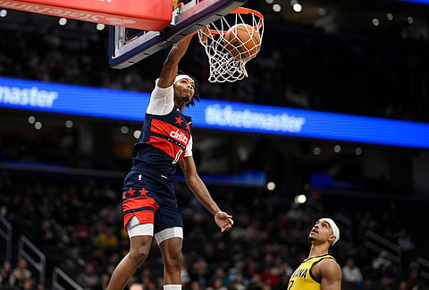 Washington Wizards guard Bilal Coulibaly (0) dunks near Indiana Pacers guard Andrew Nembhard (2) during the second half of an NBA basketball game in Washington.