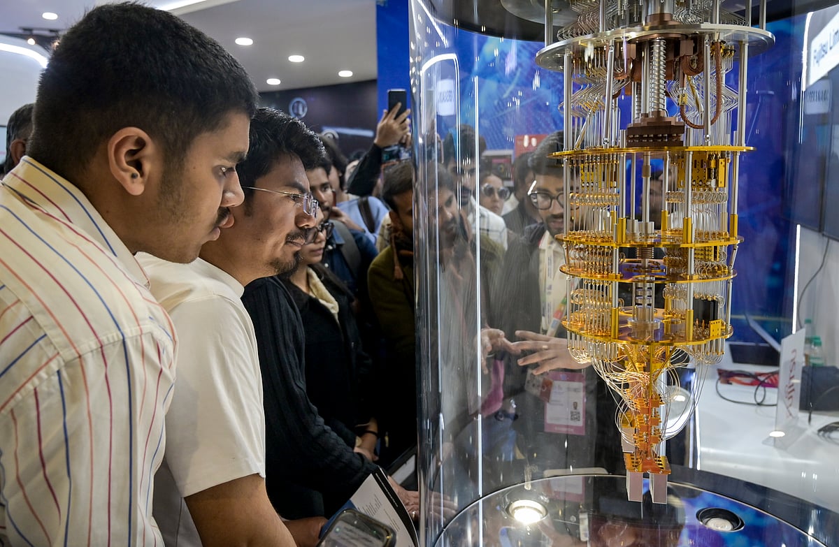 
Source : PTI :  Visitors at a stall during the AI Impact Summit, at Bharat Mandapam, in New Delhi, Wednesday, Feb. 18, 2026. 