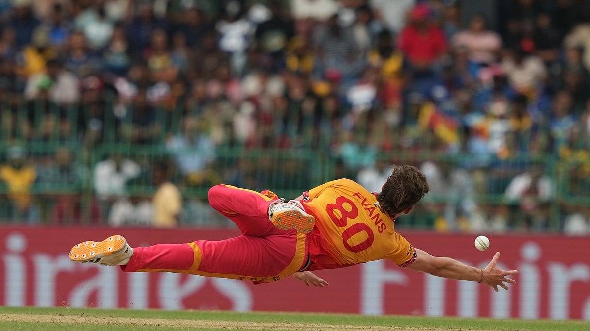(AP Photo/Eranga Jayawardena) : Zimbabwe's Bradley Evans dives to catch the ball during the T20 World Cup cricket match between Sri Lanka and Zimbabwe in Colombo, Sri Lanka, Thursday, Feb. 19, 2026.