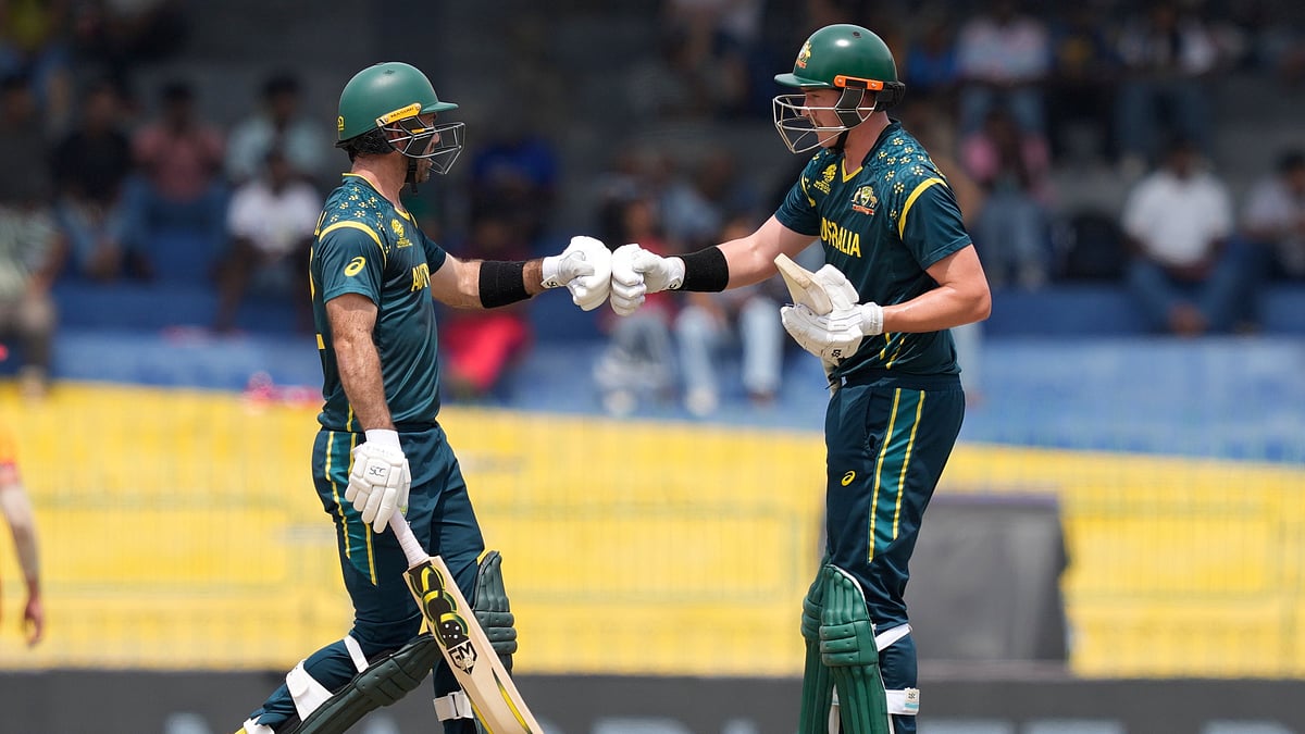| Photo: AP/Eranga Jayawardena : Australia's Glenn Maxwell, left, and Matthew Renshaw greets each other during the T20 World Cup cricket match between Australia and Zimbabwe in Colombo, Sri Lanka, Friday, Feb. 13, 2026.