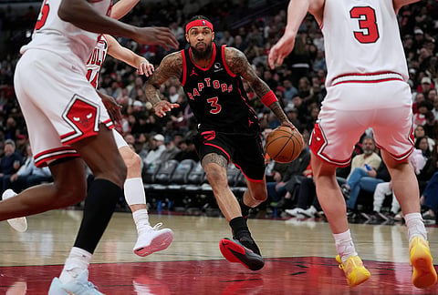 Toronto Raptors forward Brandon Ingram (3) carries the ball during the second half of an NBA basketball game against the Chicago Bulls, in Chicago.