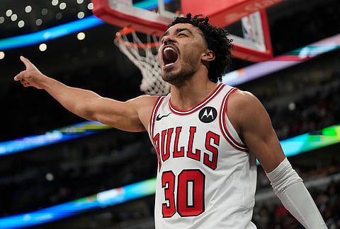 Chicago Bulls guard Tre Jones (30) reacts to a turnover by the Toronto Raptors during the second half of an NBA basketball game in Chicago.