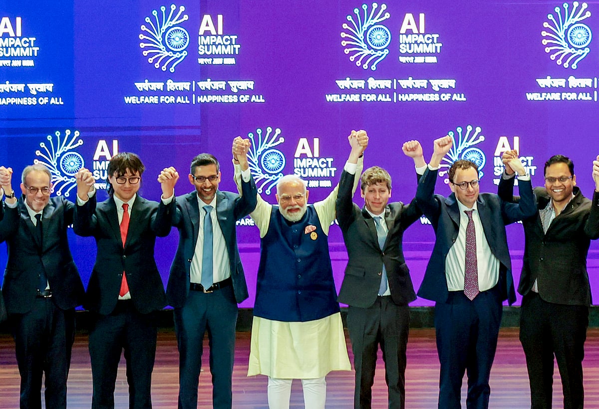 Source: PTI :  In this image received on Feb. 19, 2026, Prime Minister Narendra Modi joins hands with Google CEO Sundar Pichai, OpenAI CEO Sam Altman and others during the India AI Impact Summit 2026, in New Delhi.
