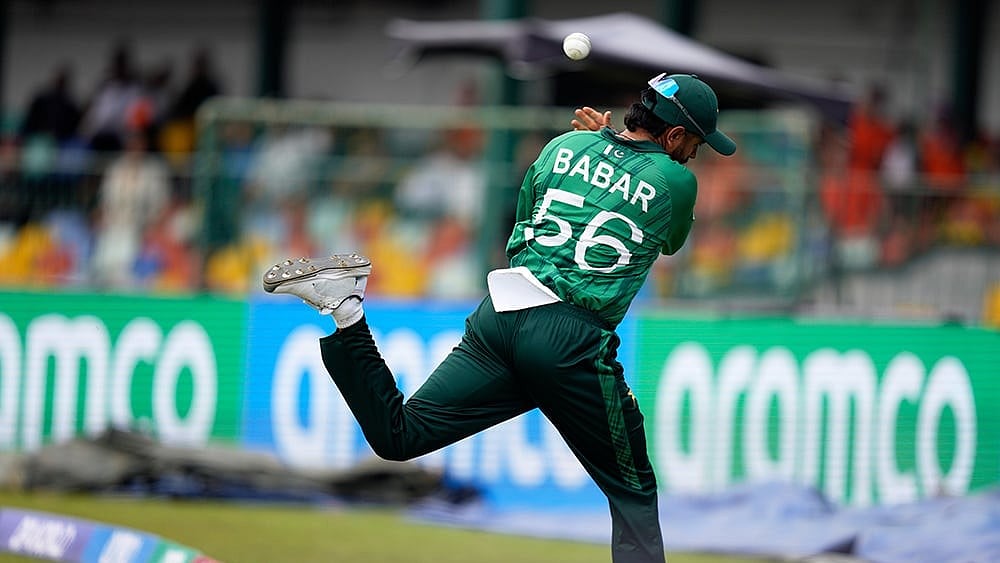 | Photo: AP/Eranga Jayawardena : Pakistan's Babar Azam throws the ball back as he jumps across the boundry rope during the T20 World Cup cricket match between Netherlands and Pakistan in Colombo, Sri Lanka.