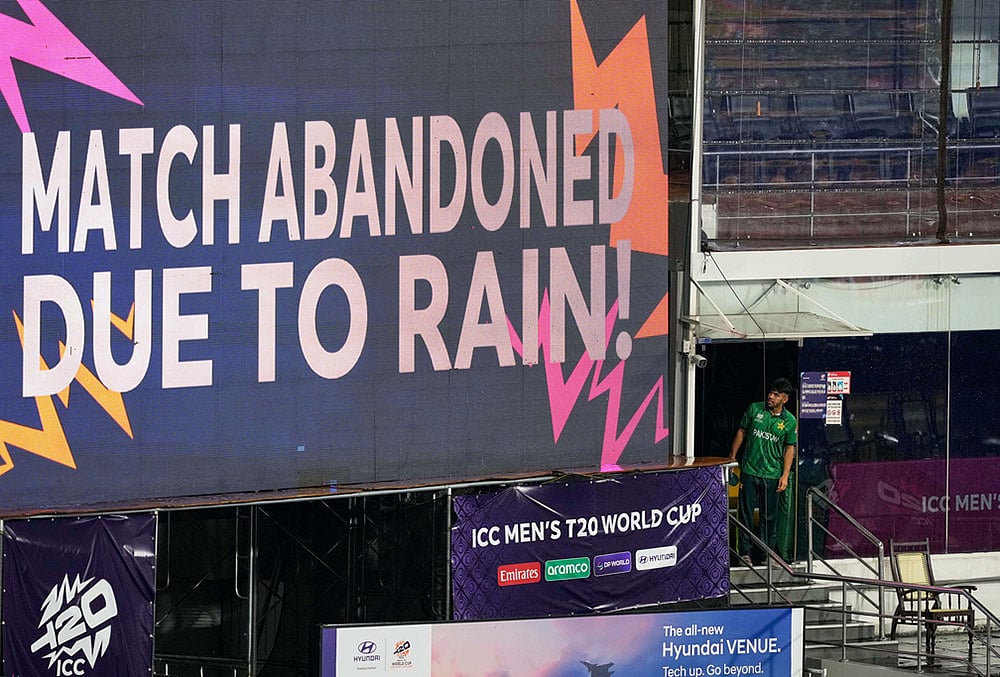 | Photo: AP/Eranga Jayawardena : Pakistan's Usman Khan looks at a large screen announcing that the T20 World Cup cricket match between New Zealand and Pakistan is abandoned due to rain, in Colombo, Sri Lanka.