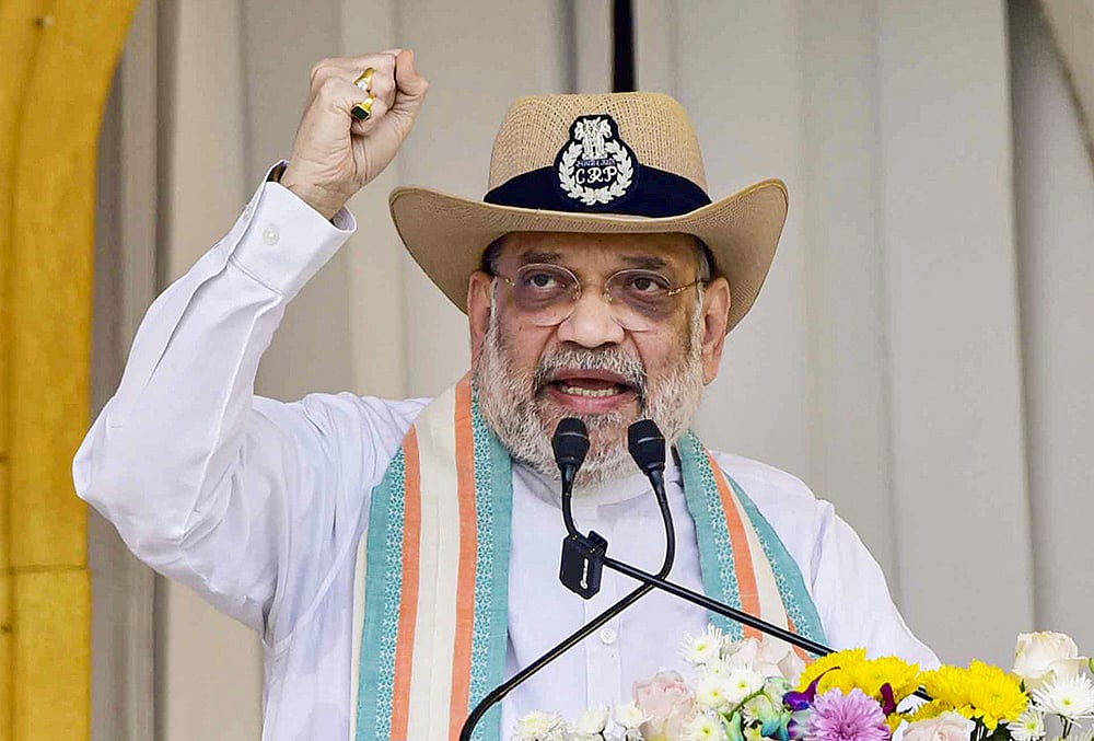 Union Home Minister Amit Shah during the 87th Raising Day Parade of the Central Reserve Police Force (CRPF), in Guwahati. - | Photo: PTI; Representative images