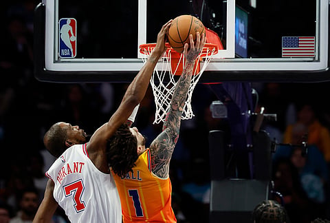 Houston Rockets forward Kevin Durant (7) blocks a shot attempt by Charlotte Hornets guard LaMelo Ball during the first half of an NBA basketball game in Charlotte, North Carolina.