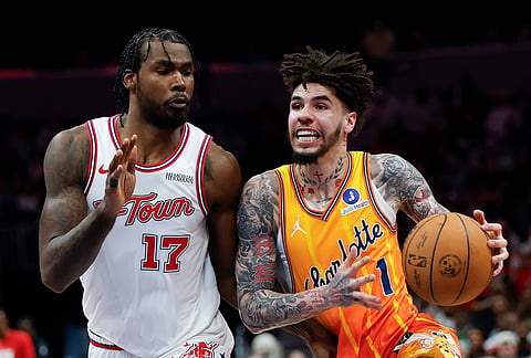 Charlotte Hornets guard LaMelo Ball (1) drives against Houston Rockets forward Tari Eason (17) during the second half of an NBA basketball game in Charlotte, North Carolina.