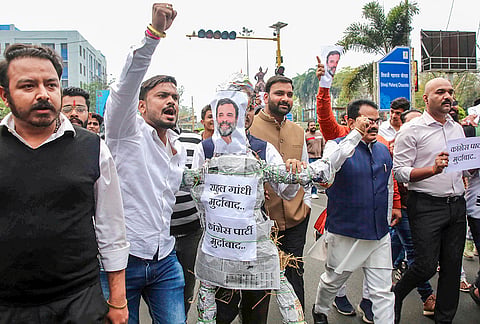 Bharatiya Janata Yuva Morcha activists carry an effigy of Leader of Opposition Rahul Gandhi to protest the Youth Congress workers' protest at the India AI Impact Summit 2026, in Bhopal.