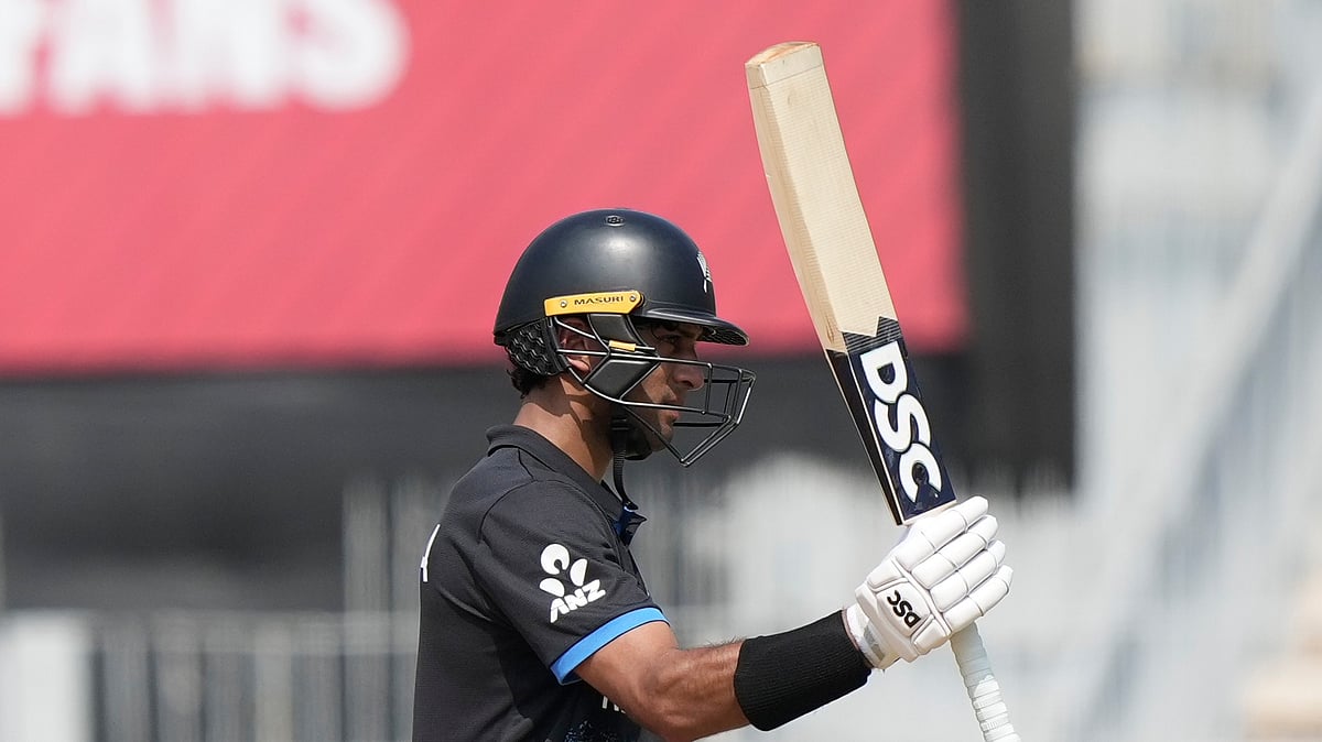 (AP Photo/Mahesh Kumar A.) : New Zealand's Rachin Ravindra celebrates his fifty runs during the T20 World Cup cricket match between Canada and New Zealand in Chennai, India, Tuesday, Feb. 17, 2026.