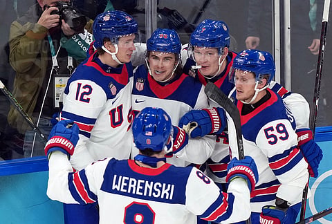 United States' Jack Hughes (86) celebrates after scoring his second goal of the game against Slovakia during the second period of a men's ice hockey semifinal game at the 2026 Winter Olympics in Milan, Italy.