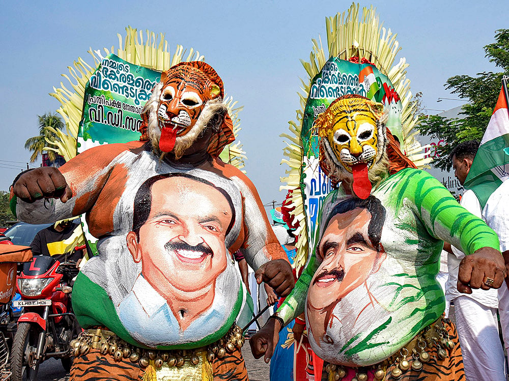 Pulikali artists display paintings of leaders during a reception meeting at Aluva as part of the UDF Puthuyuga Yatra led by Opposition Leader VD Satheesan, in Kochi, rep image | - | Photo: PTI