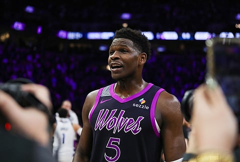 Minnesota Timberwolves' Anthony Edwards prepares for an interview after playing against the Dallas Mavericks in an NBA basketball game in Minneapolis. 