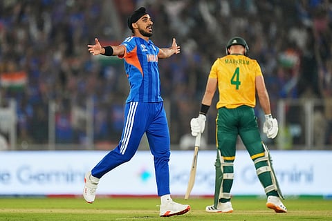 India's Arshdeep Singh celebrates the wicket of South Africa's captain Aiden Markram, right, during the T20 World Cup cricket match between India and South Africa in Ahmedabad, India.