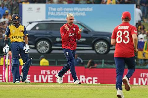 England's Will Jacks, center, celebrates with teammates the wicket of Sri Lanka's Pavan Rathnayake during the T20 World Cup cricket match between Sri Lanka and England in Pallekele, Sri Lanka.