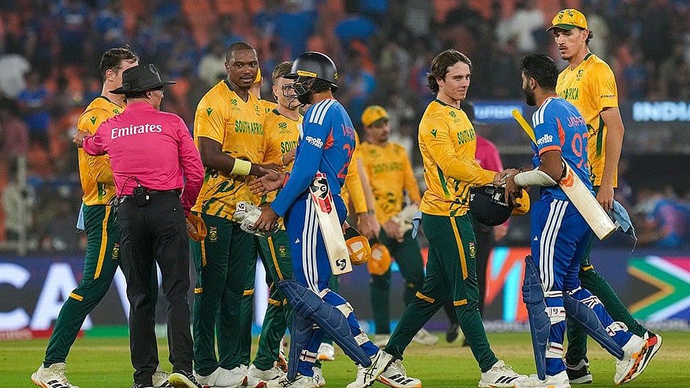 | Photo: PTI/Arun Sharma : South Africa's players being congratulated by India's Varun Chakravarthy and Jasprit Bumrah after winning the ICC Men's T20 World Cup 2026 cricket match between India and South Africa, at the Narendra Modi Stadium, in Ahmedabad.