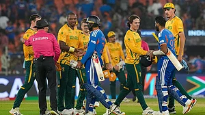 | Photo: PTI/Arun Sharma : South Africa's players being congratulated by India's Varun Chakravarthy and Jasprit Bumrah after winning the ICC Men's T20 World Cup 2026 cricket match between India and South Africa, at the Narendra Modi Stadium, in Ahmedabad.