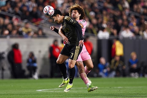 Los Angeles FC forward Son Heung-Min (7) heads the ball against Inter Miami defender Maximiliano Falcón, back right, during the second half of an MLS soccer match in Los Angeles, Calif.