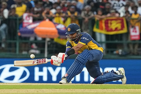 Sri Lanka's captain Dasun Shanaka plays a shot during the T20 World Cup cricket match between Sri Lanka and England in Pallekele, Sri Lanka.