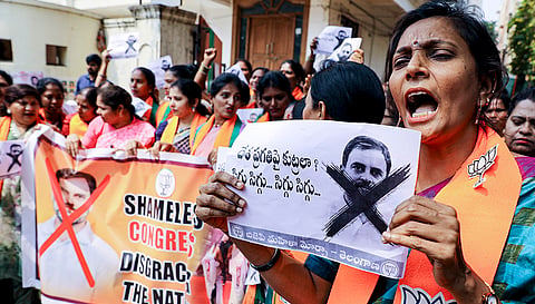 BJP Mahila Morcha activists shout slogans during a protest condemning alleged remarks by Congress youth leaders at AI Impact Summit in New Delhi, in Hyderabad.