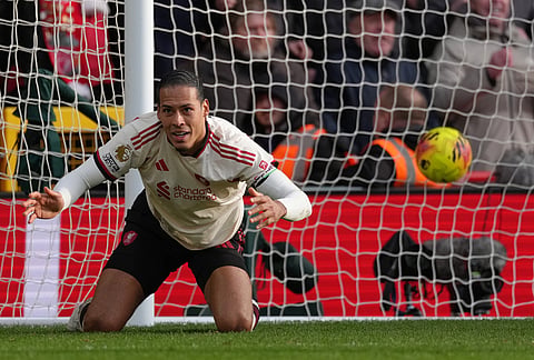 Liverpool's Virgil van Dijk reacts after his teammate Liverpool's Alexis Mac Allister scored his side's first goal during the English Premier League soccer match between Nottingham Forest and Liverpool in Nottingham.