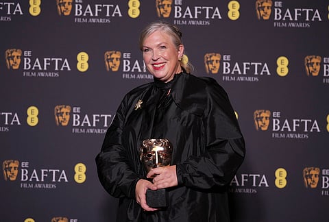 Kate Hawley poses with the award for costume design for 'Frankenstein' at the 79th British Academy Film Awards, BAFTA's, in London.