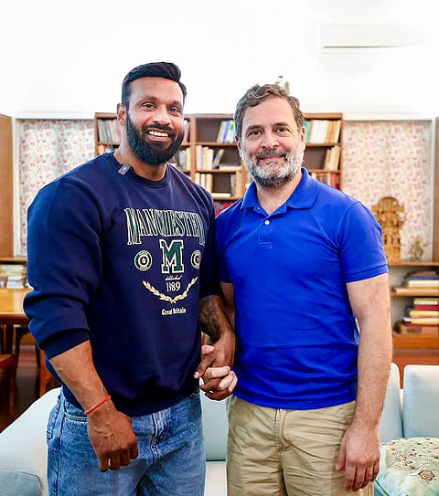 Leader of the Opposition Rahul Gandhi, right, meets Kotdwar gym owner Deepak Kumar alias Mohammad Deepak, in New Delhi. 