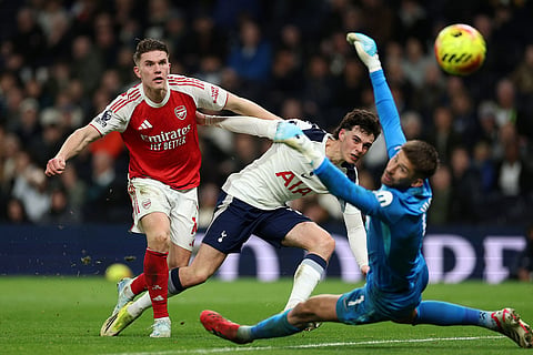 Arsenal's Viktor Gyoekeres, left, shoots to score his side's fourth goal during the English Premier League soccer match between Tottenham Hotspur and Arsenal in London.