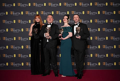 Cliona Furey, from left, Jordan Samuel, Megan Many, and Mike Hill pose with the award for make up & hair for 'Frankenstein' at the 79th British Academy Film Awards, BAFTA's, in London.