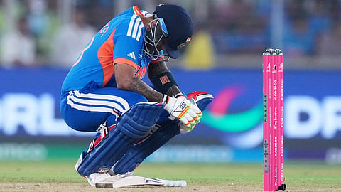 India's captain Suryakumar Yadav takes a breather after getting hit by a delivery from South Africa's Lungi Ngidi during the T20 World Cup cricket match between India and South Africa in Ahmedabad, India, Sunday, Feb. 22, 2026.
