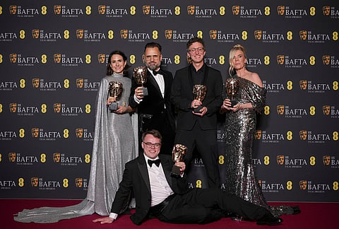 Alzbeta Karásková, from left, Pavel Talankin, Radovan Síbrt, David Borenstein, and Helle Faber pose with the award for documentary for 'Mr. Nobody Against Putin'at the 79th British Academy Film Awards, BAFTA's, in London.