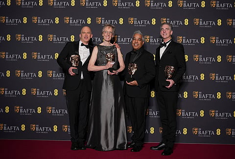 Gareth John, from left, Gwendolyn Yates Whittle, Juan Peralta, and Al Nelson pose with the award for sound for 'F1' at the 79th British Academy Film Awards, BAFTA's, in London.