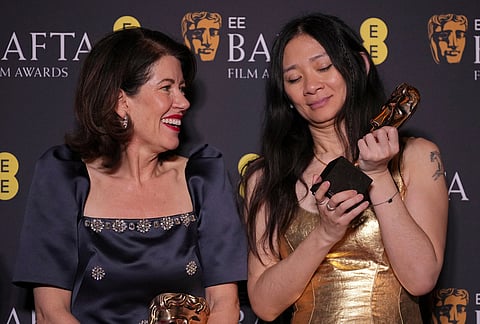 Pippa Harris, left, and Chloe Zhao pose with the award for outstanding British film for 'Hamnet' at the 79th British Academy Film Awards, BAFTA's, in London.