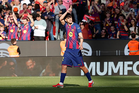 Barcelona's Marc Bernal celebrates after scoring during a La Liga soccer match between Barcelona and Levante in Barcelona, Spain.