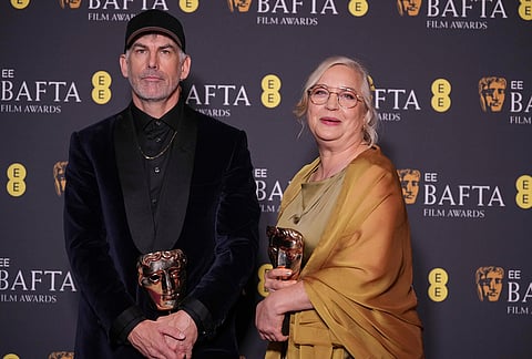 Shane Vieau, Tamara Deverell pose with the award for production design for 'Frankenstein'at the 79th British Academy Film Awards, BAFTA's, in London.