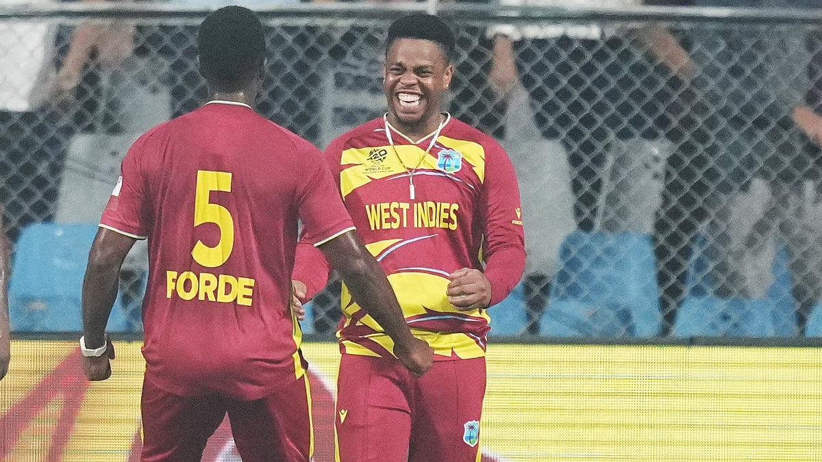 | Photo: AP/Rafiq Maqbool : West Indies' Matthew Forde celebrates with Shimron Hetmyer, right, the wicket of Zimbabwe's Tadiwanashe Marumani during the T20 World Cup cricket match between Zimbabwe and West Indies in Mumbai, India, Monday, Feb. 23, 2026. 