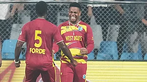 | Photo: AP/Rafiq Maqbool : West Indies' Matthew Forde celebrates with Shimron Hetmyer, right, the wicket of Zimbabwe's Tadiwanashe Marumani during the T20 World Cup cricket match between Zimbabwe and West Indies in Mumbai, India, Monday, Feb. 23, 2026.