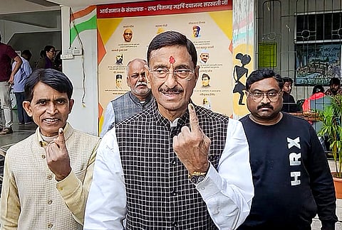 Union Minister of State for Defence Sanjay Seth shows his ink-marked finger after casting a vote during the Ranchi Municipal Corporation (RMC) election, at a polling station, in Ranchi, Jharkhand.