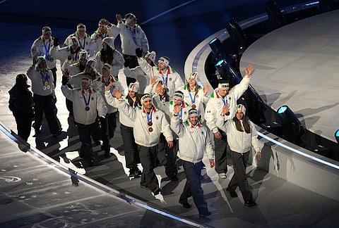 Italian medallists arrive for the closing ceremony of the 2026 Winter Olympics, in Verona, Italy.
