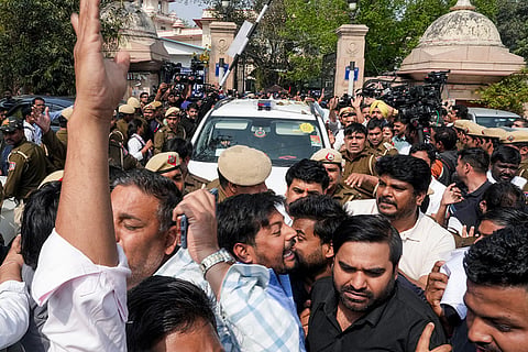 Congress workers protest outside Patiala House Court as Indian Youth Congress (IYC) national president Uday Bhanu Chib is produced before the court following his arrest in connection with a protest at the AI Impact Summit, in New Delhi.