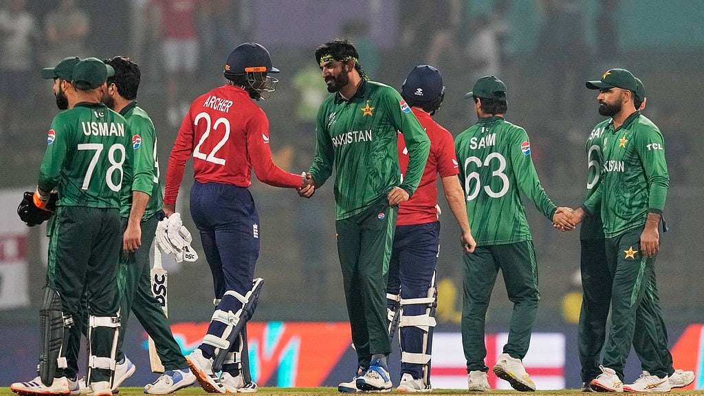 AP Photo/Eranga Jayawardena : England's Jofra Archer, centre, and Liam Dawson shake hands after winning the T20 World Cup cricket match between England and Pakistan in Pallekele, Sri Lanka, Tuesday, Feb. 24, 2026.