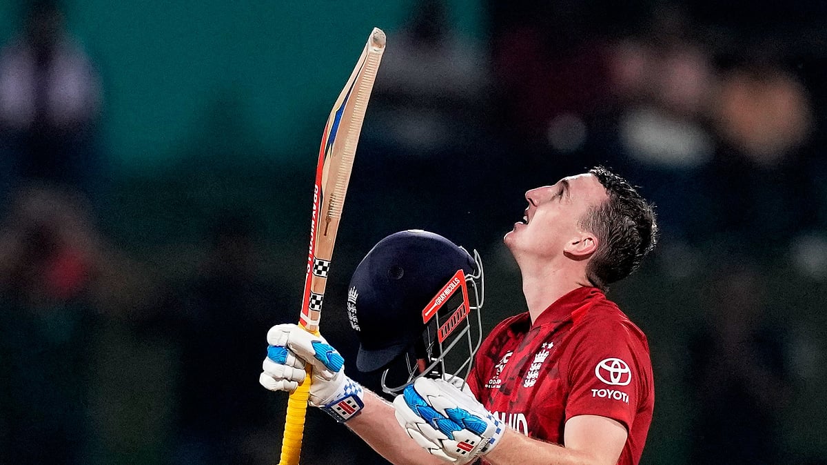 (AP Photo/Eranga Jayawardena) : England's captain Harry Brook celebrates his century during the T20 World Cup cricket match between England and Pakistan in Pallekele, Sri Lanka, Tuesday, Feb. 24, 2026. 
