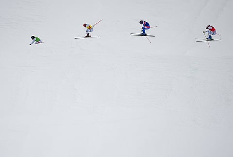 From left, Switzerland's Talina Gantenbein (5), Switzerland's Sixtine Cousin (13), France's Anouck Errard (12) and Switzerland's Saskja Lack (4) compete during the women's ski cross finals at the 2026 Winter Olympics, in Livigno, Italy, Friday, Feb. 20, 2026. 