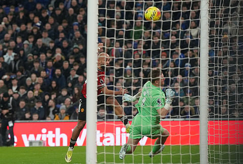 Manchester United's Bryan Mbeumo misses during the Premier League soccer match between Manchester United and Everton in Liverpool, England.