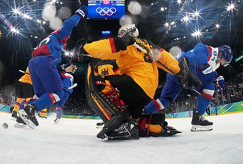 Slovakia's Pavol Regenda (84) celebrates after scoring his side's opening goal during a men's ice hockey quarterfinal game between Slovakia and Germany at the 2026 Winter Olympics, in Milan, Italy, Wednesday, Feb. 18, 2026. 
