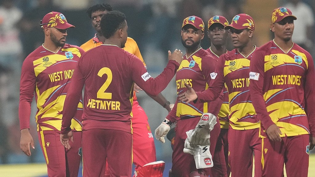 AP : West Indies' Shimron Hetmyer, second from left, celebrates with teammates after their win against Zimbabwe during the T20 World Cup match in Mumbai.