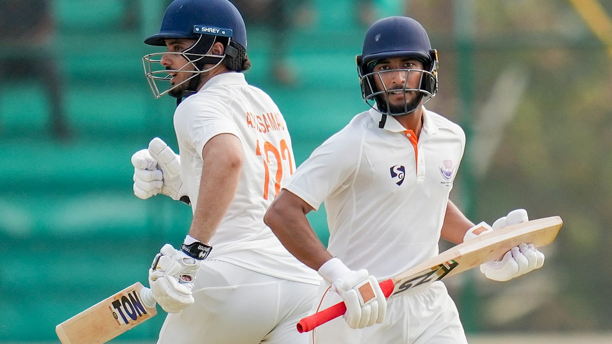 (PTI Photo/Shailendra Bhojak) : Jammu and Kashmir's Shubham Pundir and Abdul Samad run between the wickets during the first day of the Ranji Trophy 2025-26 final cricket match between Karnataka and Jammu & Kashmir, at KSCA Cricket Stadium, in Hubballi, Karnataka, Tuesday, Feb. 24, 2026. 